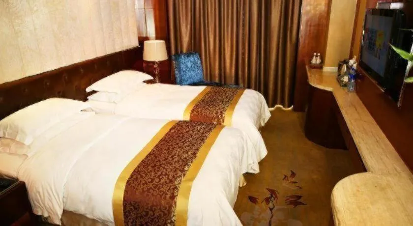 Bed in Maison New Century Hotel Wuyuan Haiyan