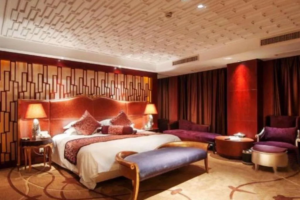 Bed in Maison New Century Hotel Wuyuan Haiyan