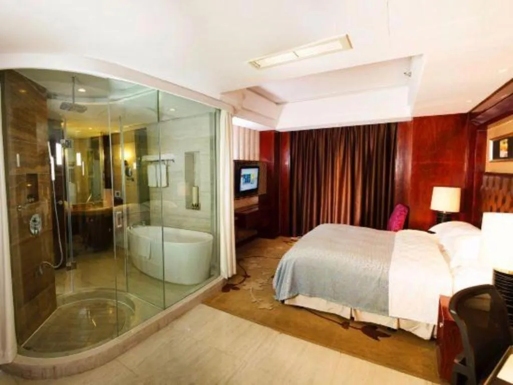 Bed in Maison New Century Hotel Wuyuan Haiyan