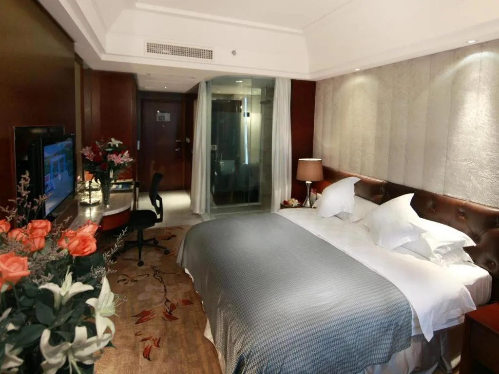 Bed in Maison New Century Hotel Wuyuan Haiyan