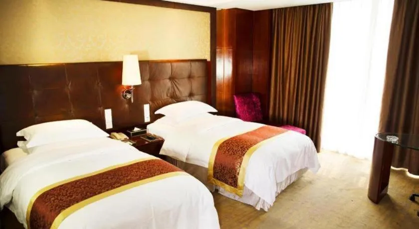 Bed in Maison New Century Hotel Wuyuan Haiyan