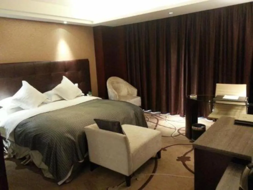 Bed in Maison New Century Hotel Wuyuan Haiyan