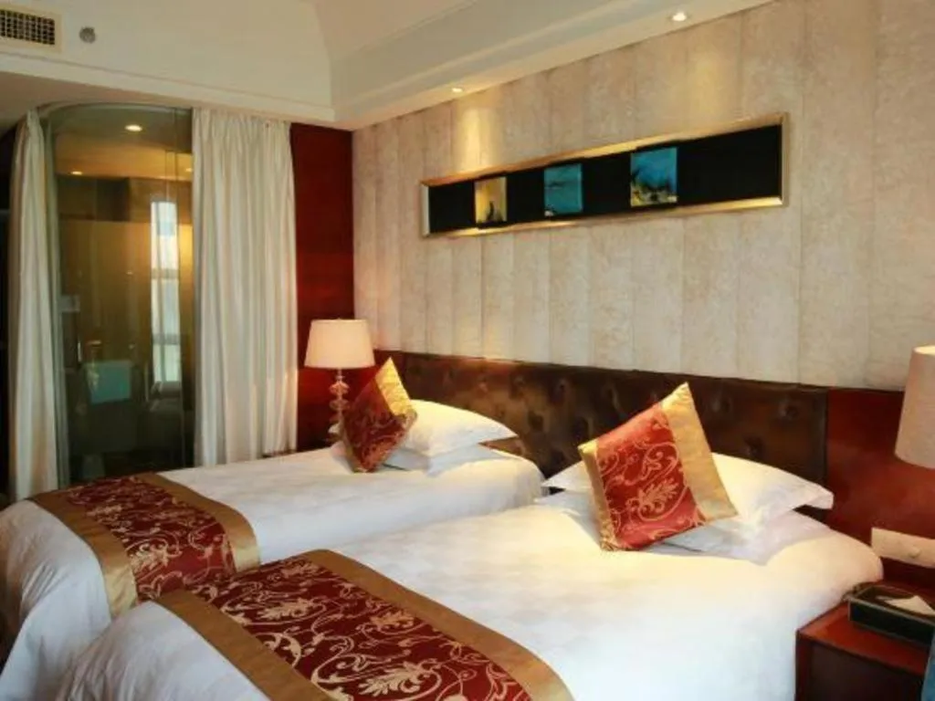 Bed in Maison New Century Hotel Wuyuan Haiyan