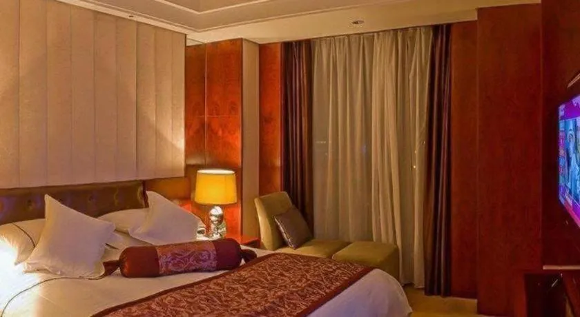 Bed in Maison New Century Hotel Wuyuan Haiyan