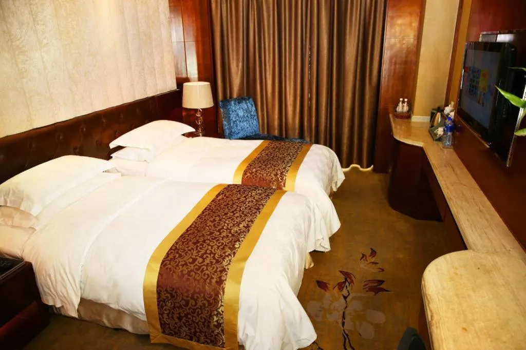 Bed in Maison New Century Hotel Wuyuan Haiyan