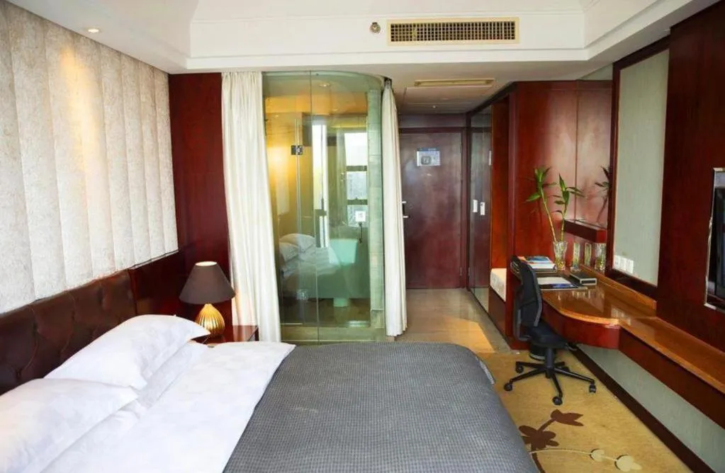 Bed in Maison New Century Hotel Wuyuan Haiyan