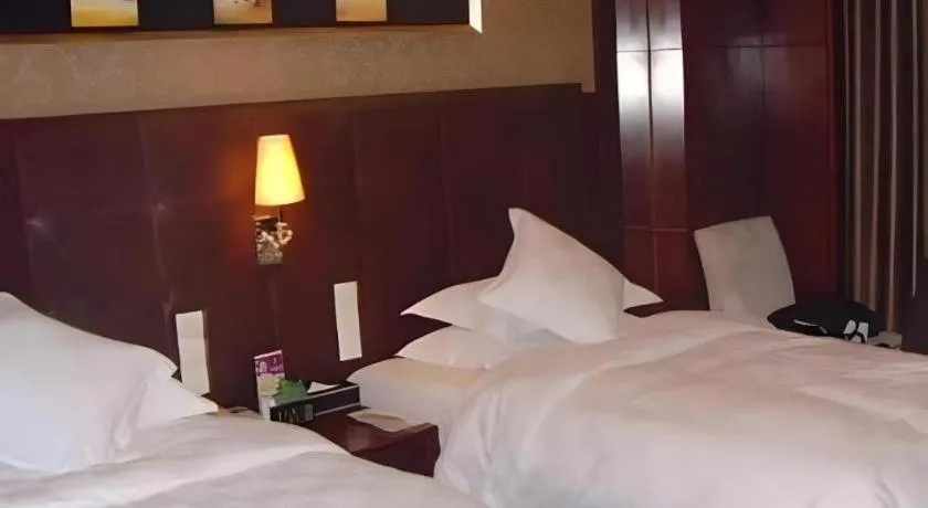 Bed in Maison New Century Hotel Wuyuan Haiyan