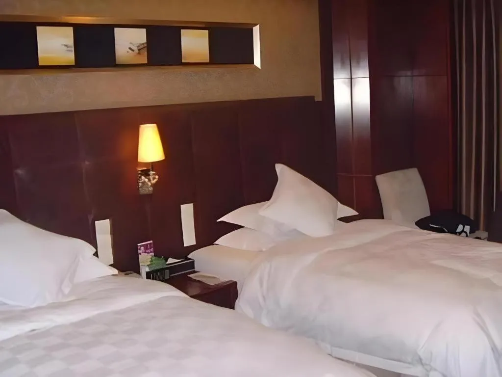 Bed in Maison New Century Hotel Wuyuan Haiyan