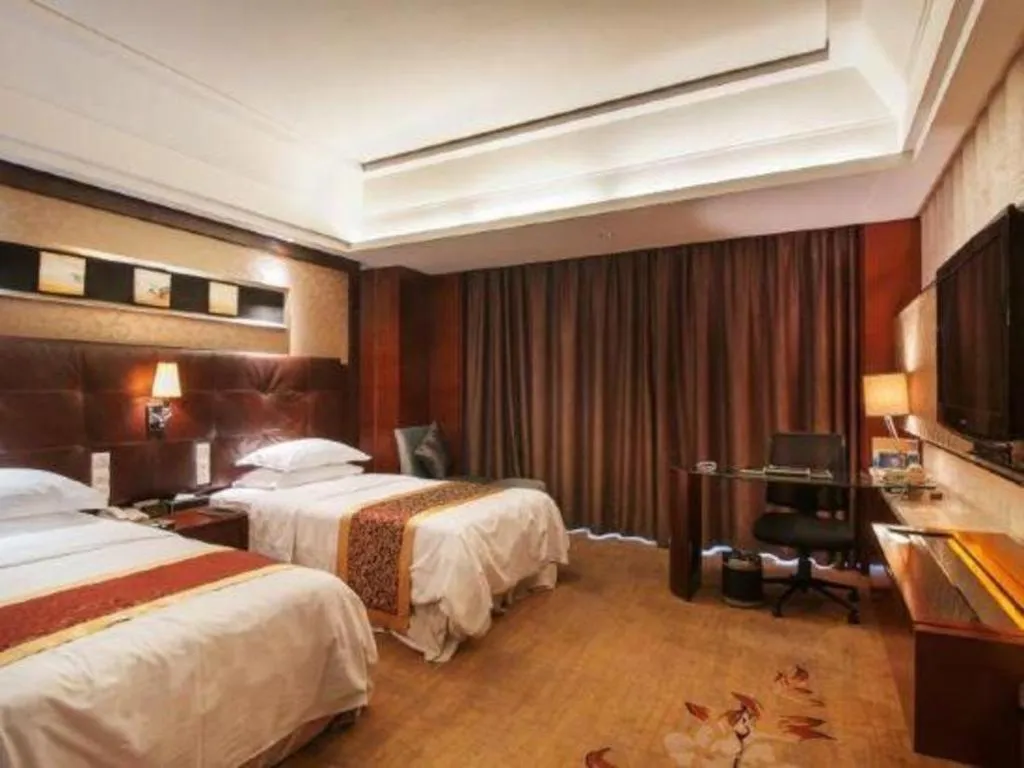 Bed in Maison New Century Hotel Wuyuan Haiyan