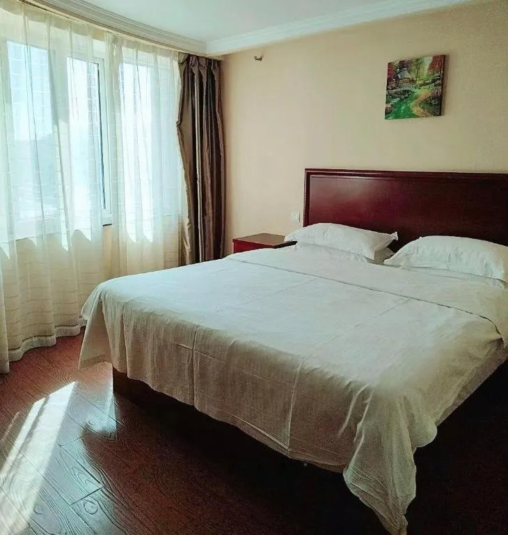 Bed in GreenTree Inn Huaian Lianshui Jindi International Garden Business Hotel