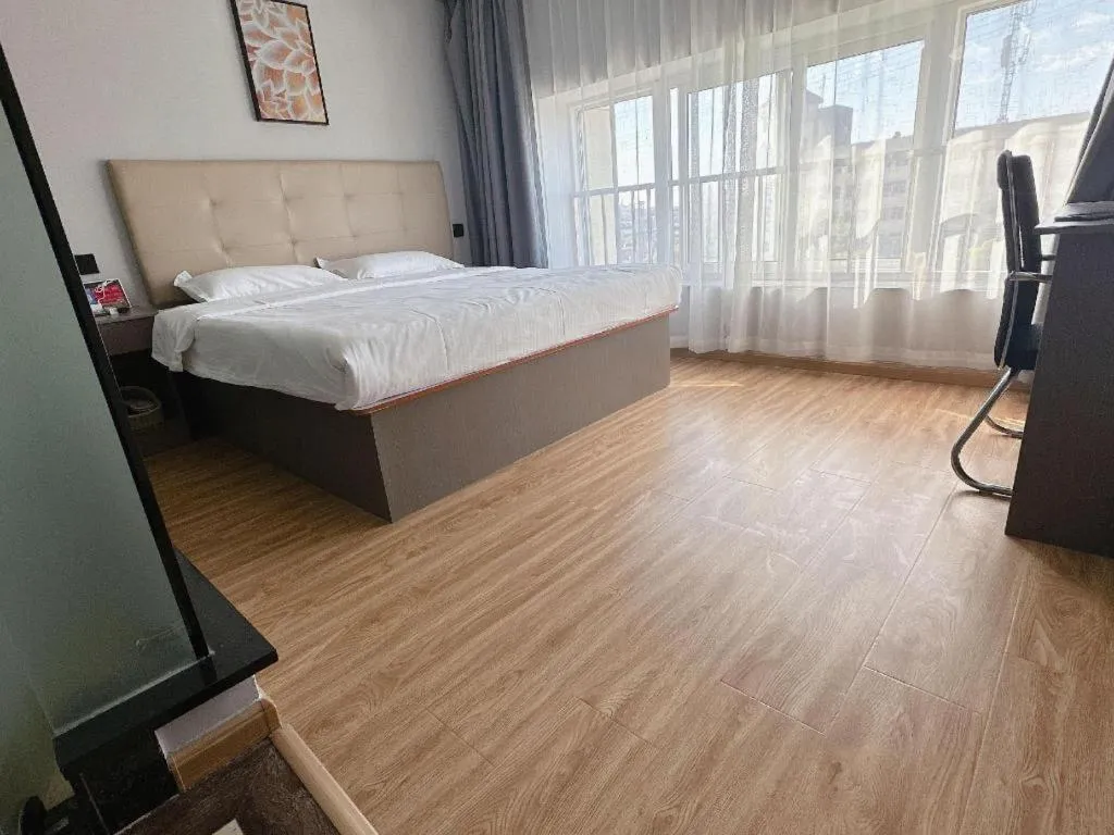 Bed in GreenTree Inn Huaian Lianshui Jindi International Garden Business Hotel