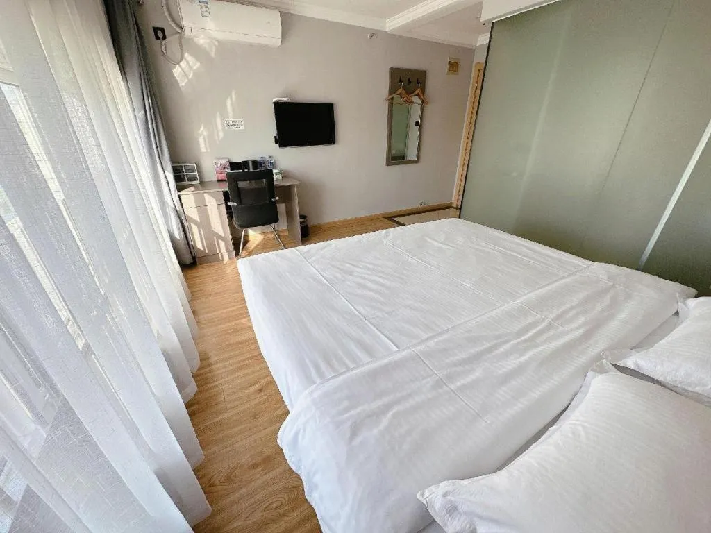 Bed in GreenTree Inn Huaian Lianshui Jindi International Garden Business Hotel