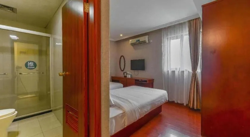 Bed in GreenTree Inn Shanghai South Railway Station Xujiahui Stadium Subway Station Shell Hotel