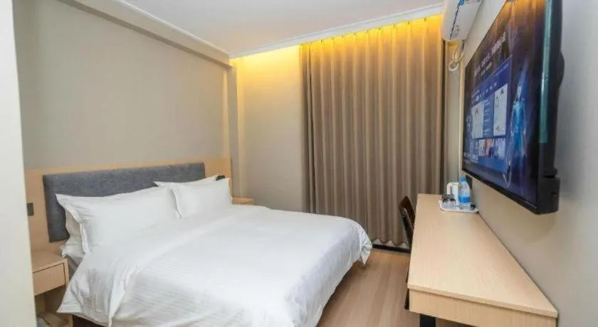 Bed in GreenTree Inn Shanghai South Railway Station Xujiahui Stadium Subway Station Shell Hotel