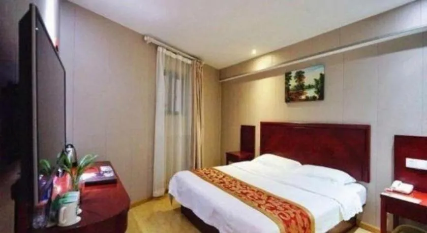Bed in GreenTree Inn Shanghai South Railway Station Xujiahui Stadium Subway Station Shell Hotel
