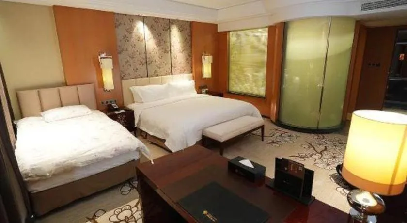 Bed in Zhangjiagang Zhonglian GDH International Hotel