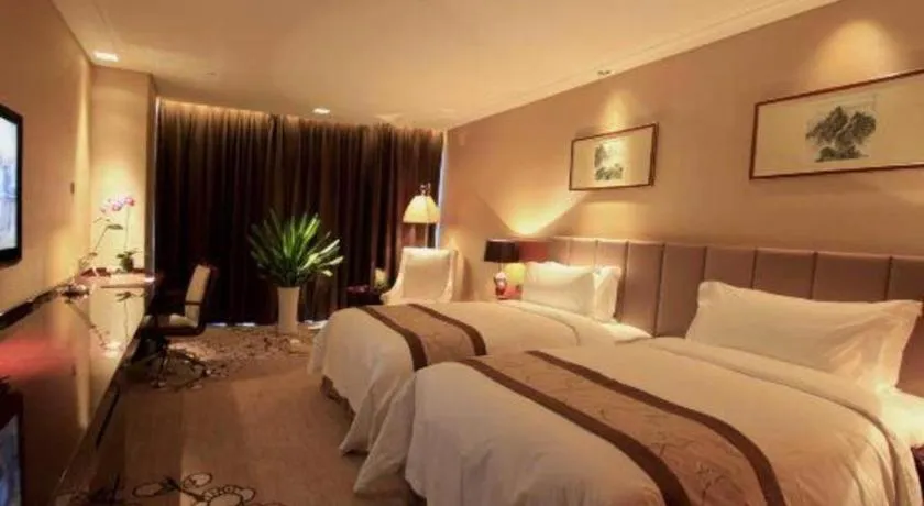 Bed in Zhangjiagang Zhonglian GDH International Hotel