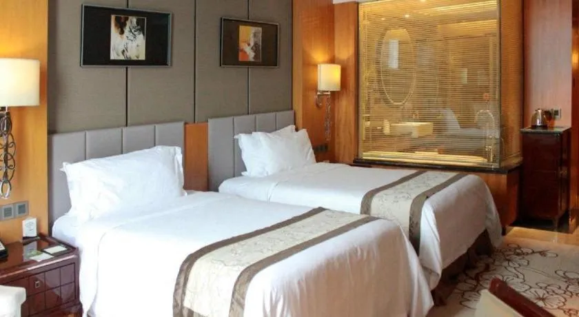 Bed in Zhangjiagang Zhonglian GDH International Hotel