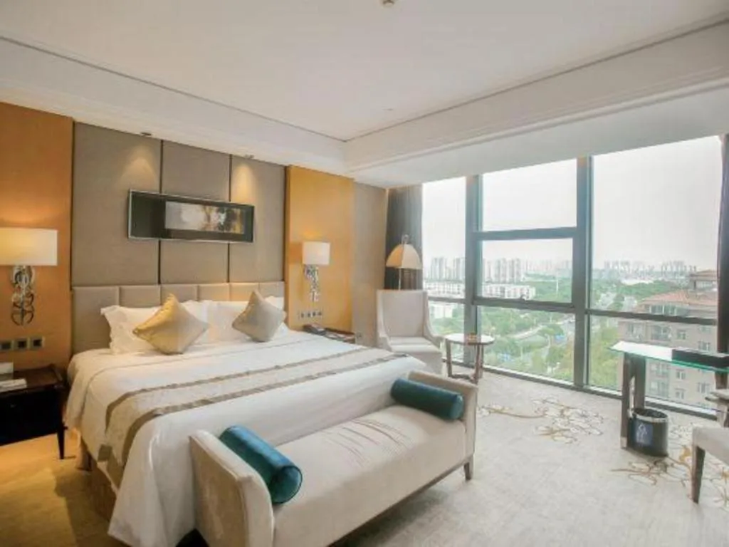 Bed in Zhangjiagang Zhonglian GDH International Hotel