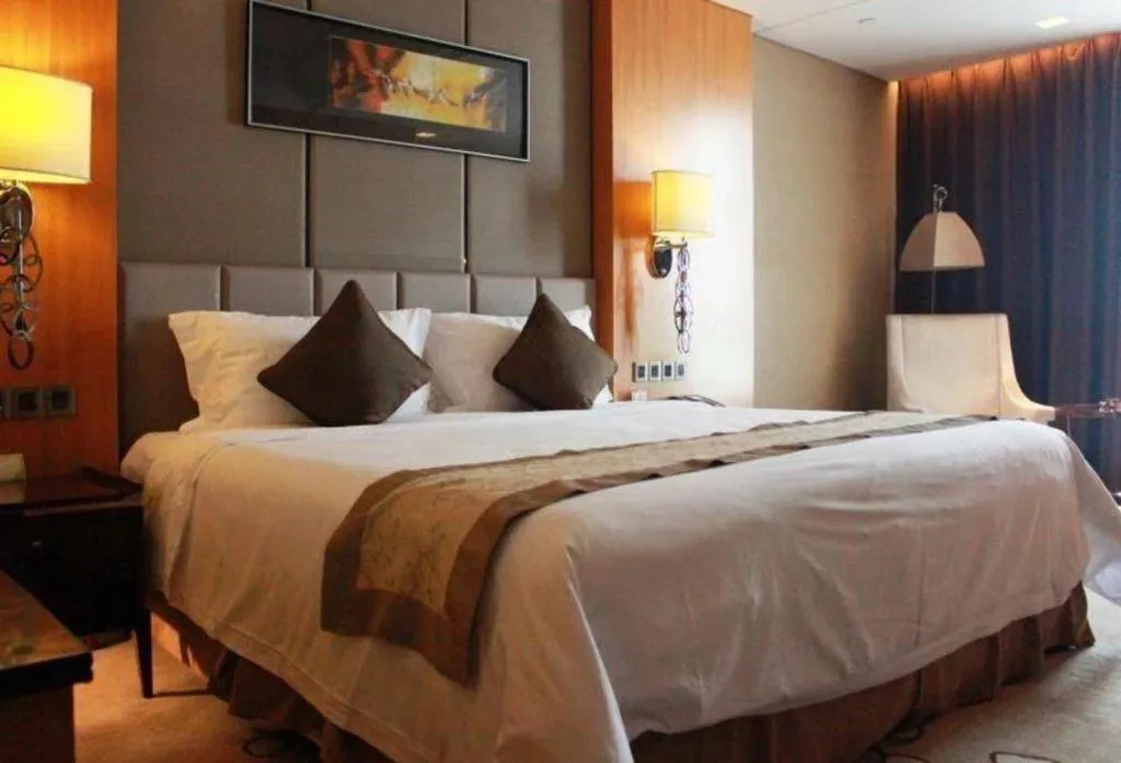 Bed in Zhangjiagang Zhonglian GDH International Hotel