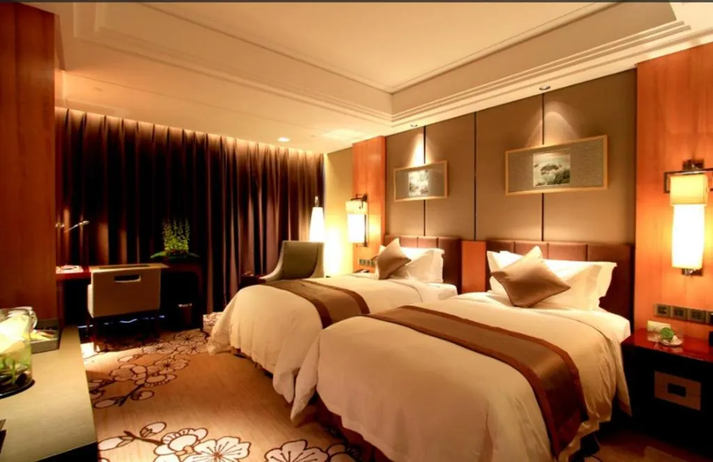 Bed in Zhangjiagang Zhonglian GDH International Hotel