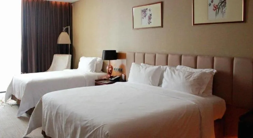 Bed in Zhangjiagang Zhonglian GDH International Hotel