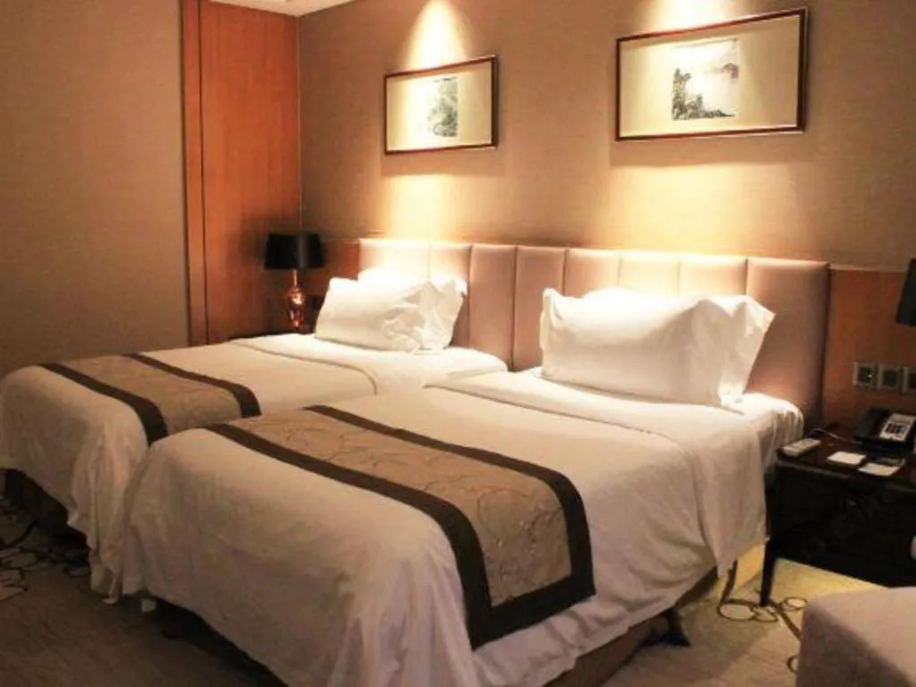 Bed in Zhangjiagang Zhonglian GDH International Hotel