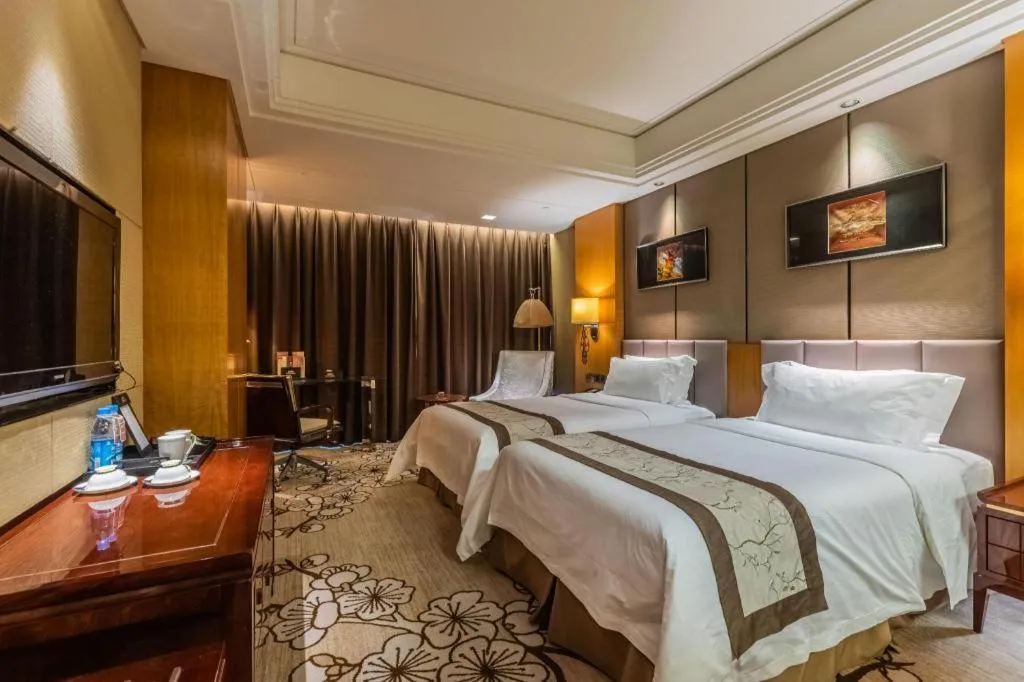 Bed in Zhangjiagang Zhonglian GDH International Hotel