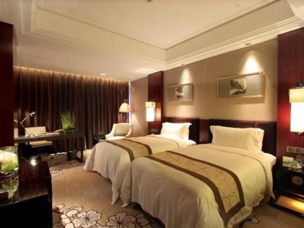 Bed in Zhangjiagang Zhonglian GDH International Hotel