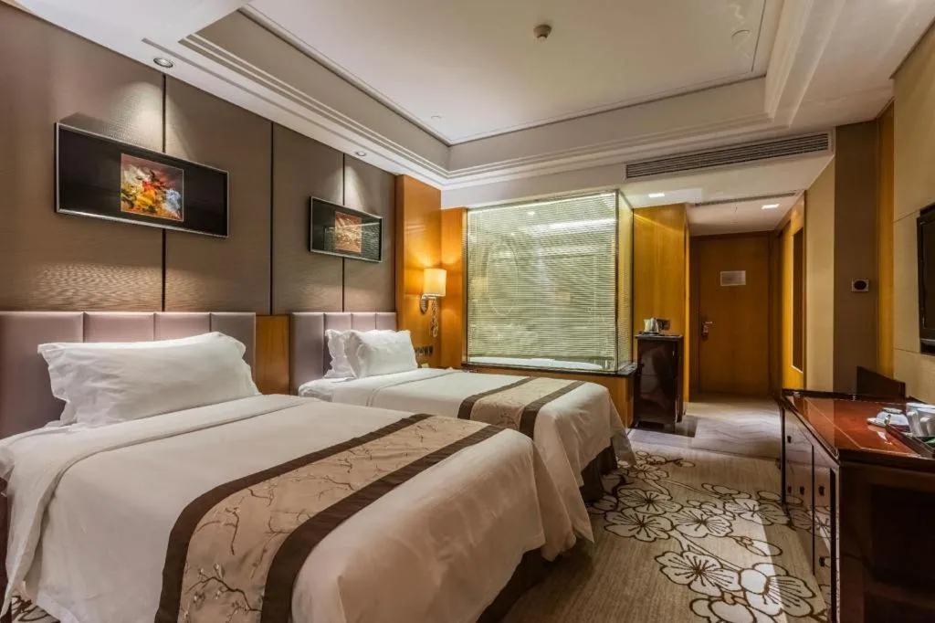 Bed in Zhangjiagang Zhonglian GDH International Hotel