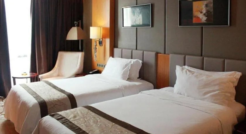 Bed in Zhangjiagang Zhonglian GDH International Hotel