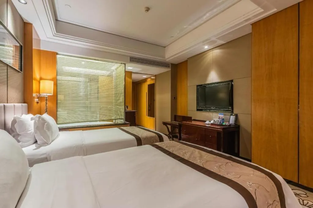 Bed in Zhangjiagang Zhonglian GDH International Hotel