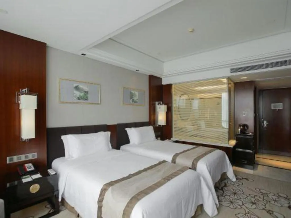 Bed in Zhangjiagang Zhonglian GDH International Hotel