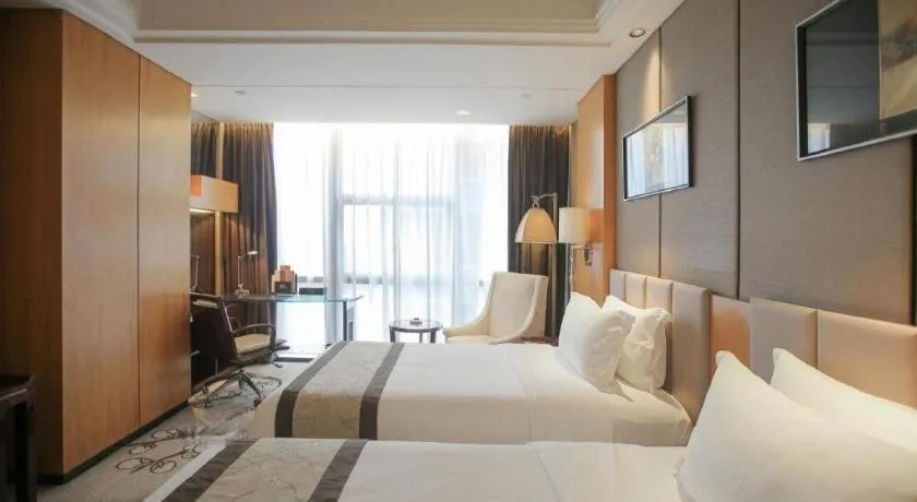 Bed in Zhangjiagang Zhonglian GDH International Hotel