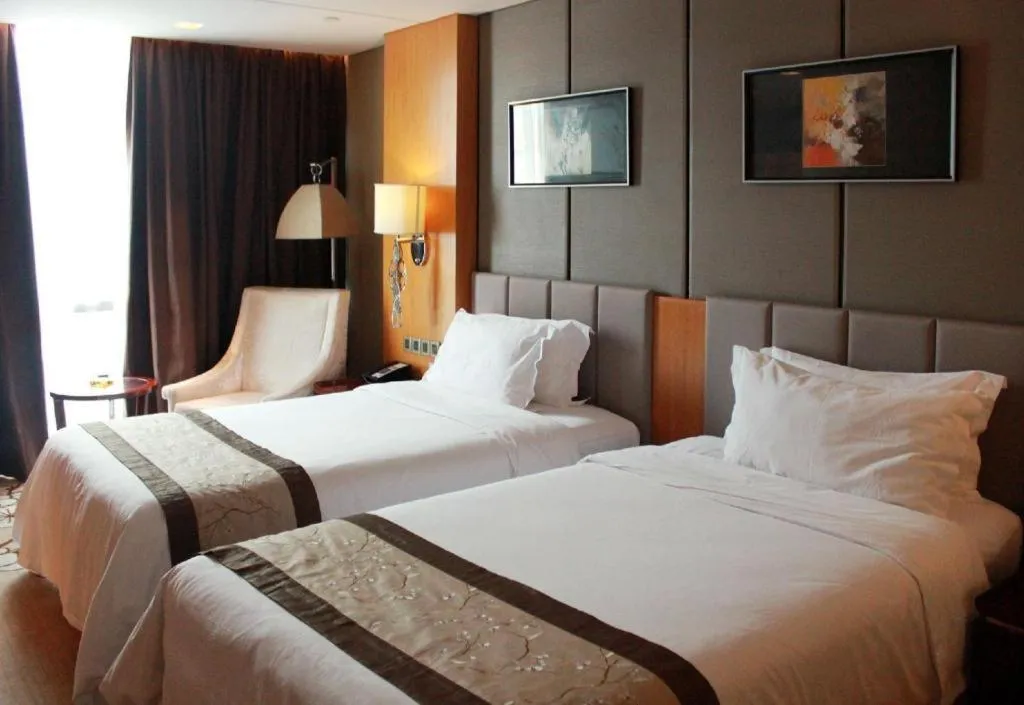 Bed in Zhangjiagang Zhonglian GDH International Hotel