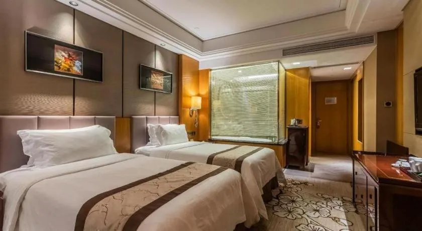 Bed in Zhangjiagang Zhonglian GDH International Hotel