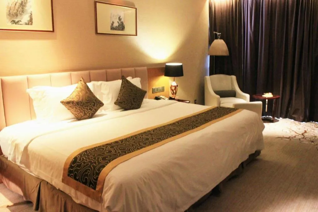 Bed in Zhangjiagang Zhonglian GDH International Hotel