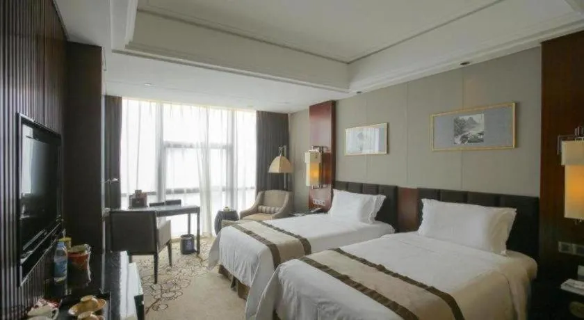 Bed in Zhangjiagang Zhonglian GDH International Hotel