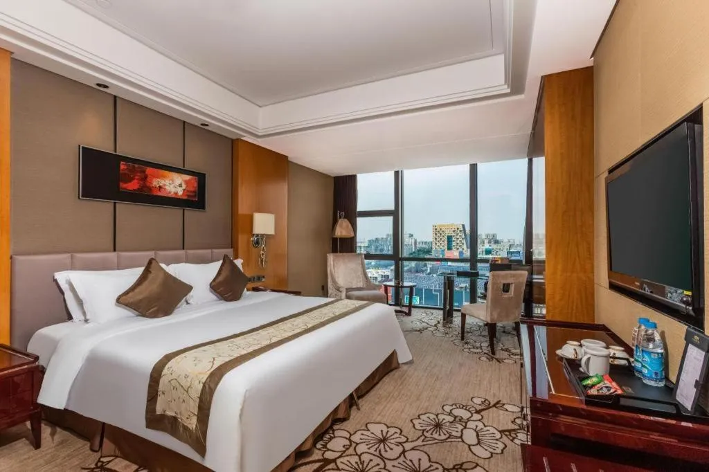 Bed in Zhangjiagang Zhonglian GDH International Hotel