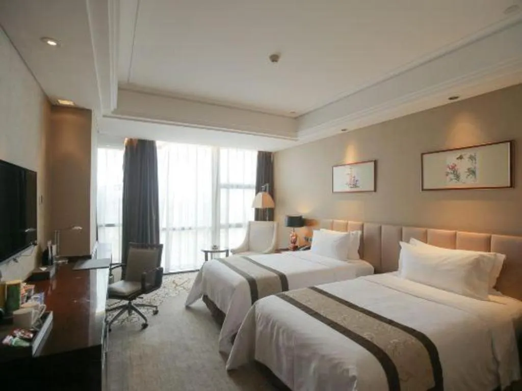 Bed in Zhangjiagang Zhonglian GDH International Hotel