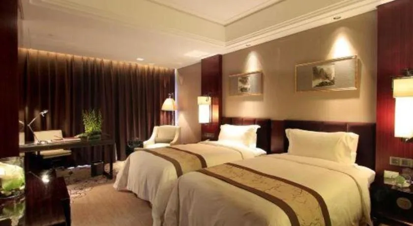 Bed in Zhangjiagang Zhonglian GDH International Hotel