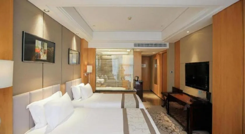 Bed in Zhangjiagang Zhonglian GDH International Hotel