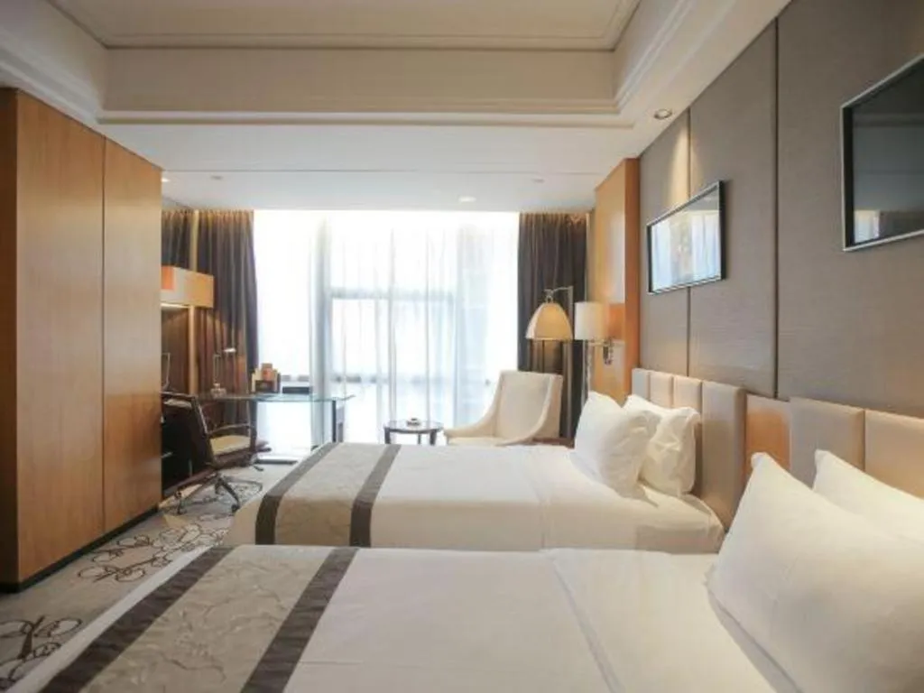 Bed in Zhangjiagang Zhonglian GDH International Hotel