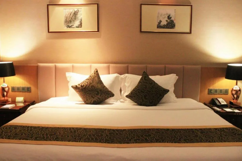 Bed in Zhangjiagang Zhonglian GDH International Hotel