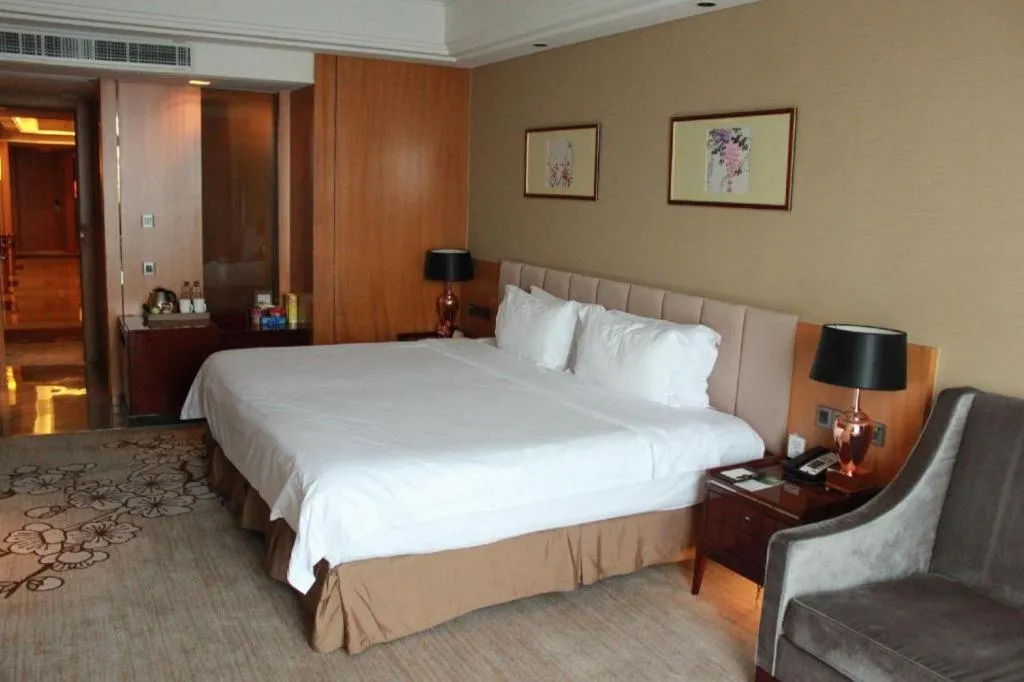 Bed in Zhangjiagang Zhonglian GDH International Hotel