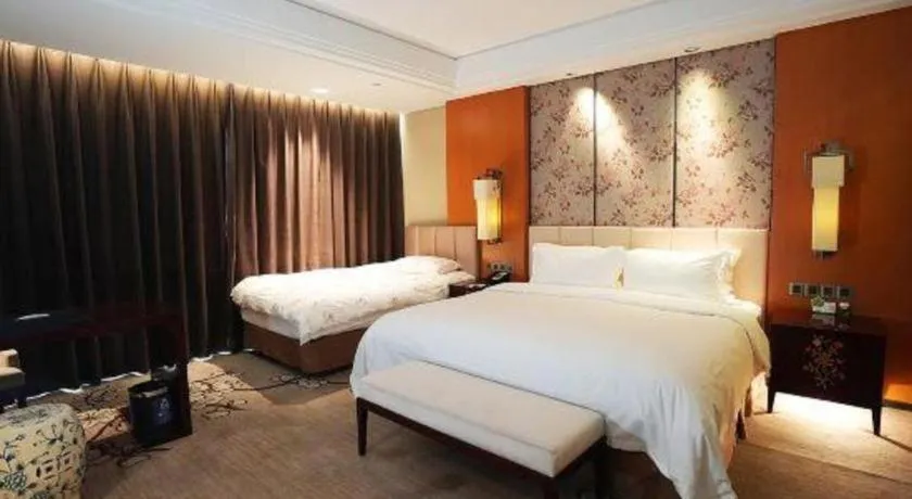 Bed in Zhangjiagang Zhonglian GDH International Hotel