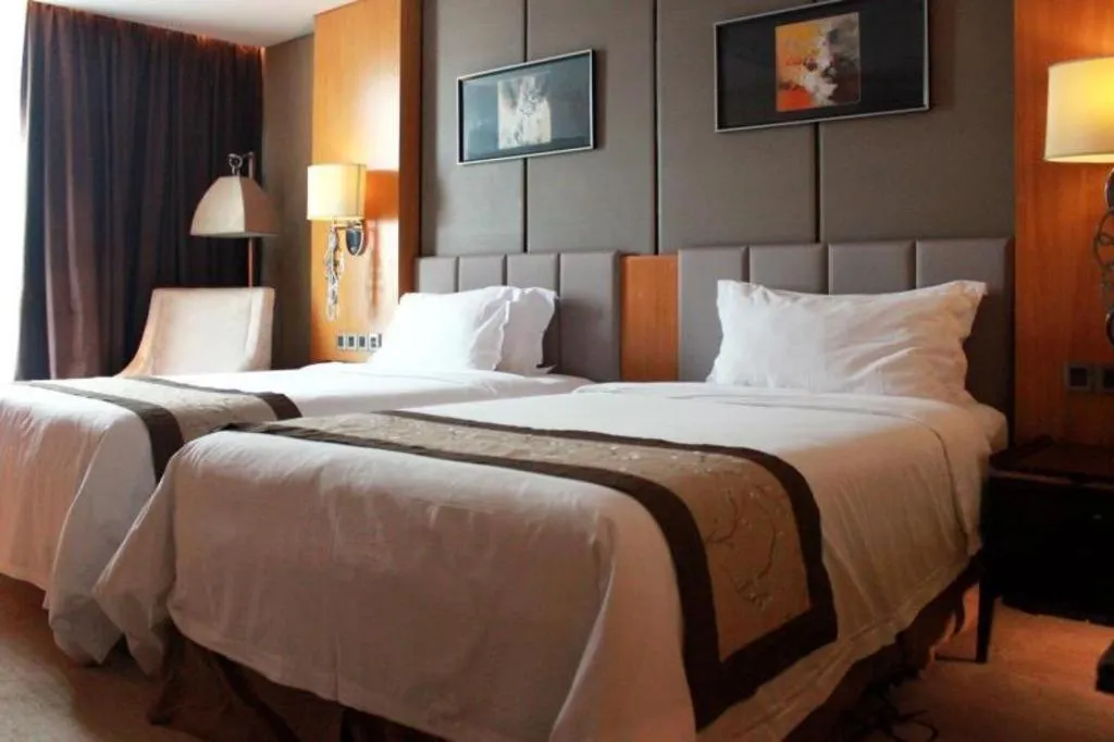 Bed in Zhangjiagang Zhonglian GDH International Hotel