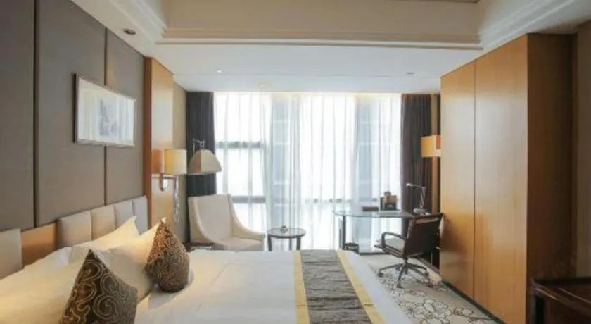 Bed in Zhangjiagang Zhonglian GDH International Hotel