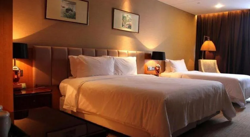 Bed in Zhangjiagang Zhonglian GDH International Hotel