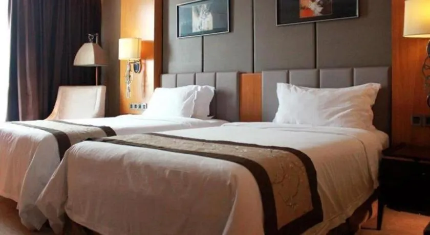 Bed in Zhangjiagang Zhonglian GDH International Hotel